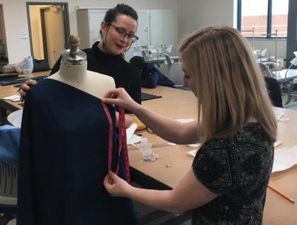 Ali Eagen working on draping project with student